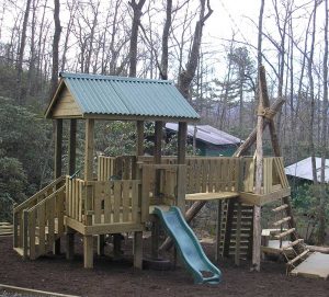 Log TeePee and fort playground at Campcrest - Asheville Playgrounds